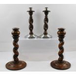 TWO PAIRS OF BARLEY TWIST CANDLESTICKS, tallest pair 23cm high