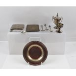 A MISCELLANY OF SILVER ITEMS comprising; two engraved cigarette cases, a dish, two small trophy cups