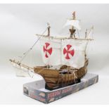 A 20TH CENTURY WOODEN MODEL SHIP 'SANTA MARIA' with fabric sails on stand, 53cm high