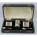 J.B. CHATTERLEY AND SONS LTD. A THREE PIECE SILVER CONDIMENT SET of plain canted form, Art Deco in