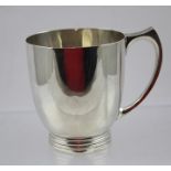 JAMES DIXON & SONS A SILVER CHRISTENING MUG having plain ovoid body, swept hollow handle, on