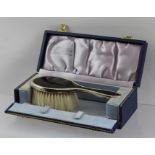 COLLETT AND ANDERSON A MID 20TH CENTURY SILVER AND TORTOISESHELL CHILD'S HAND BRUSH in original box,