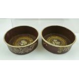 A PAIR OF TOLE PEINTRE WINE BOTTLE COASTERS painted inside with fruiting vine motifs,