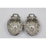 HENRY MATHEWS & CO A PAIR OF VICTORIAN PRESSED SILVER BONBON/ NUT DISHES each all over decorated