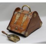 A LATE VICTORIAN POLISHED OAK PURDONIUM with decorative brass fittings, complete with shovel and tin