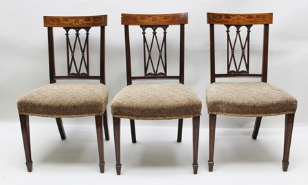 A SET OF SIX SHERATON DESIGN MAHOGANY SINGLE DINING CHAIRS, the back crest with acanthus leaf