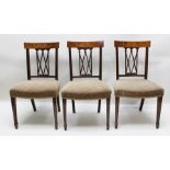 A SET OF SIX SHERATON DESIGN MAHOGANY SINGLE DINING CHAIRS, the back crest with acanthus leaf