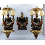 A PAIR OF POLYCHROME COMPOSITION TWIN-LIGHT WALL APPLIQUES, each modelled as a seated Chinaman,