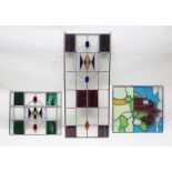 THREE LEADED STAINED GLASS PANELS, one with chapel in landscape design, 61cm x 56cm