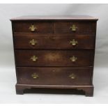 A GEORGE III OAK CHEST OF TWO SHORT OVER THREE LONG GRADUATED DRAWERS with brass shaped back plate