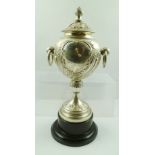JAMES DEAKIN AND SONS A LATE VICTORIAN SILVER TROPHY CUP of globular form with ring handles, on a