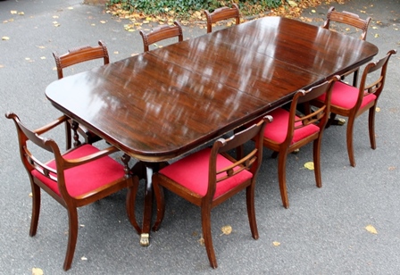 A GEORGIAN STYLE TWIN PEDESTAL MAHOGANY DINING with additional leaf, together with EIGHT GEORGIAN
