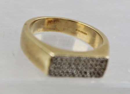 A 9CT GOLD UNISEX DIAMOND FINGER RING having a rectangular head set with 60 small diamonds, on a - Image 2 of 2