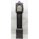 JAMES CLARK OF FROME A CARVED OAK LONGCASE CLOCK the hood with columns flanking the brass arched top