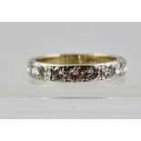 AN 18CT GOLD ETERNITY RING set with nine diamonds, size P and half
