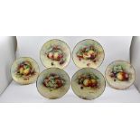 A SET OF SIX MINTON HAND PAINTED CABINET PLATES decorated with various fruits against a mossy