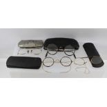 FOUR PAIRS OF EARLY SPECTACLES, cased, to include a pair of Pince-Nez with ear attaching securing