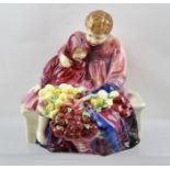 A ROYAL DOULTON FIGURE GROUP "Flower Seller's Children", depicting a young boy and girl sitting on a