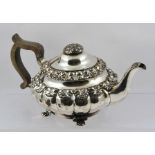 A 19TH CENTURY, POSSIBLY WILLIAM IV, SHEFFIELD PLATED TEAPOT of squat lobed form with applied