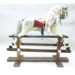 AN EARLY 20TH CENTURY "LINES" DAPPLE GREY ROCKING HORSE, circa 1925, sympathetically restored to