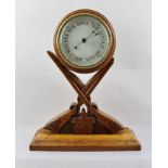 AN EARLY 20TH CENTURY CONTINENTAL DESK OR MANTEL BAROMETER, the circular dial set within a turned