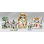 A COLLECTION OF FIVE PIECES OF VICTORIAN STAFFORDSHIRE POTTERY, includes castle spill holder and