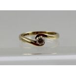 A 9CT GOLD SOLITAIRE DIAMOND RING, stamped 375, size M and half