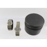 A PAIR OF "PORSCHE" DESIGN TITANIUM WRIST WATCHES, one lady's, one gentleman's, each having black