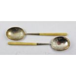 TWO WALKER AND HALL (John Edward Bingham) SHEFFIELD SILVER BOWLED SPOONS with engraved decoration,