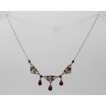 A VICTORIAN 9CT GOLD AND AMETHYST NECKLACE, having three decorative grape and vine triangular