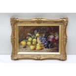 VINCENT CLARE 'Still life fruit and basket beside a mossy bank', oil painting on canvas, signed in