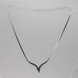 A 9CT WHITE GOLD AND DIAMOND MODERNIST STYLE NECKLACE