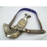 AN OMANI KNANJAR DAGGER IN SCABBARD with finely wire worked belt, gold mounted silver item of some