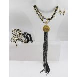 TWO FLAPPER NECKLACES, one with pair of matching earrings