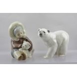 TWO LATE 20TH CENTURY LLADRO MODELS, one a Polar Bear, the other a seated Eskimo Child cuddling a