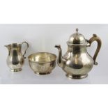 C S HARRIS & SONS LTD A GEORGE II STYLE THREE PIECE SILVER TEA SET comprising; a baluster form