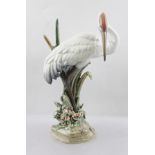 A LATE 20TH CENTURY LLADRO MODEL OF A CRANE in reeds, modelled and decorated in typical muted