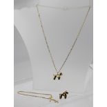 TWO 9CT GOLD POODLE FORM PENDANTS, one on a 9ct gold neck chain, together with a 9ct chain