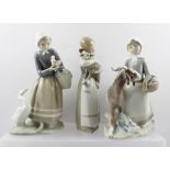 THREE LLADRO PORCELAIN FIGURINES, includes a girl with a basket and goat, 22cm high, a girl carrying