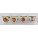 A SET OF FOUR PORCELAIN CHINESE SAKE CUPS with flared rims, enamelled and Greek key rim and mons,