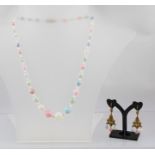 AN ART DECO STYLE NECKLACE WITH MATCHING EARRINGS, in four tone opaline glass