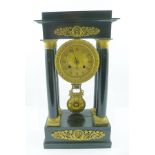 A LATE VICTORIAN EBONISED PORTICO CLOCK, having gilt metal decorative mounts and capped columns,