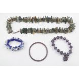 A POLISHED MOSS AGATE STONE NECKLACE together with a polished stone disc bangle and two other