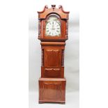 GRIFFITH JONES, 9 POOL STREET, CARNARVON A 19TH CENTURY MAHOGANY LONGCASE CLOCK, having wide swan