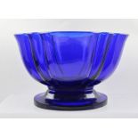 A 19TH CENTURY BRISTOL BLUE GLASS BOWL, of oval stylised petal form on platform base, ground beneath