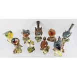 A COLLECTION OF NINE BESWICK EARTHENWARE MODELS OF BIRDS to include a Greenfinch, Goldcrest,