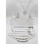 A SELECTION OF SILVER AND SILVER COLOURED METAL COSTUME JEWELLERY, mainly pendants and necklaces