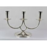 A "BERG" DANISH SILVER PLATED TABLE CANDELABRA of three sconce design, on a wire frame and