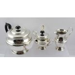 A SILVER PLATED THREE-PIECE TEA SET, comprising teapot, lidded sugar bowl and milk jug, together