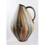 A MID 20TH CENTURY WEST HANDARBEIT POTTERY JUG of tear drop form, decorated in stripes and geometric